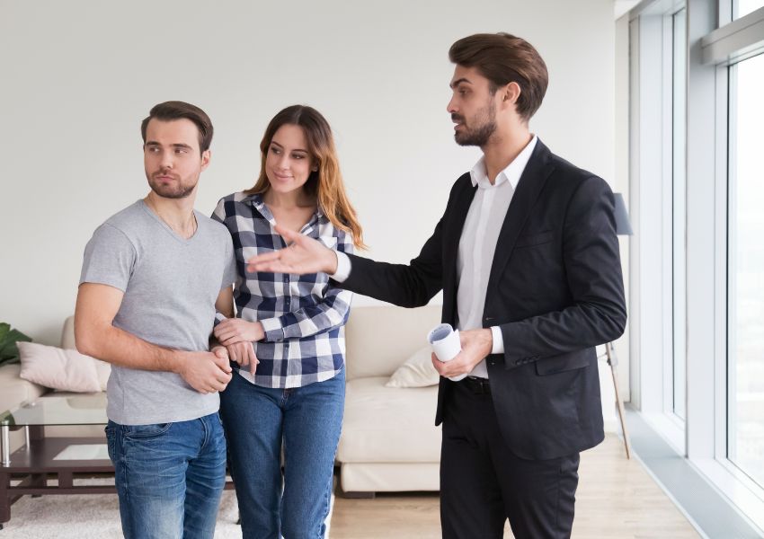 landlord-showing-property-with-couple